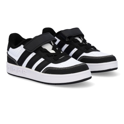 Sapatilhas brancas e pretas adidas com fecho velcro e atacadores.