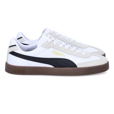 Sapatilhas Puma brancas com faixa preta e sola castanha