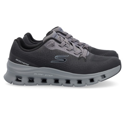 Ténis desportivos Skechers cinza escuro e preto com sola cinza e cadarços cinza.