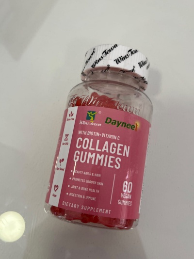 Frasco de suplemento dietético Collagen Gummies com rótulo rosa e tampa branca selada