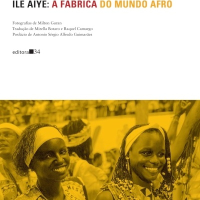 Capa do livro ILÊ AIYÊ: A FÁBRICA DO MUNDO AFRO com foto de mulheres afro em trajes culturais.