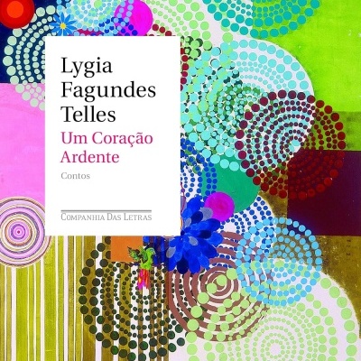 Capa de livro colorida com padrão abstrato de círculos e texto no centro