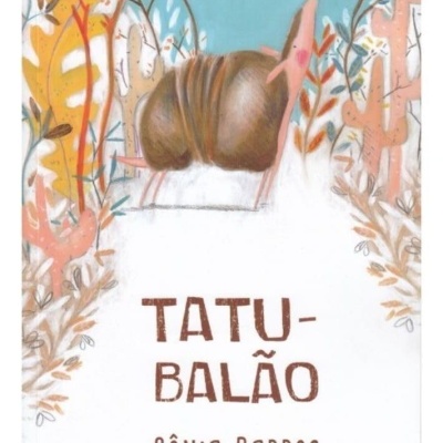 Capa de livro infantil com tatu e vegetação colorida e título TATU-BALÃO.