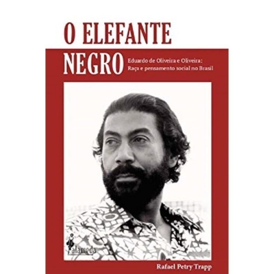 Capa de livro O ELEFANTE NEGRO com foto de homem e texto em vermelho e branco