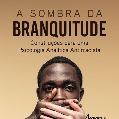 Capa do livro A Sombra da Branquitude com imagem de rosto de homem negro com mãos cobrindo a boca