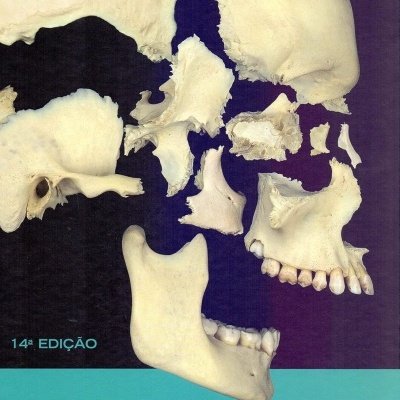 Partes do crânio humano dispostas sobre fundo azul escuro com título e autores do livro
