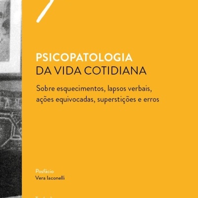 Capa de livro amarelo com texto preto e branco e faixa preta vertical com imagem desfocada