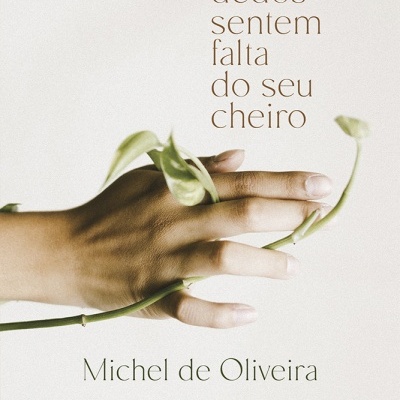 Mão humana segurando caule verde com folhas e texto em português.