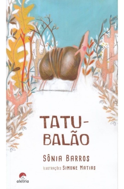Capa de livro infantil com tatu e vegetação colorida e título TATU-BALÃO.