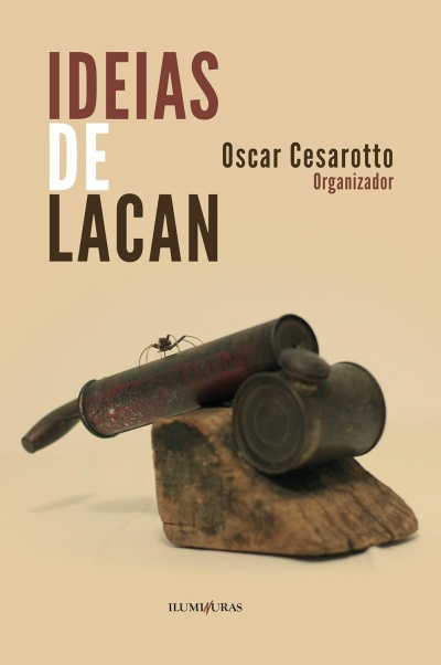 Capa de livro IDEIAS DE LACAN com objeto metálico e aranha sobre madeira