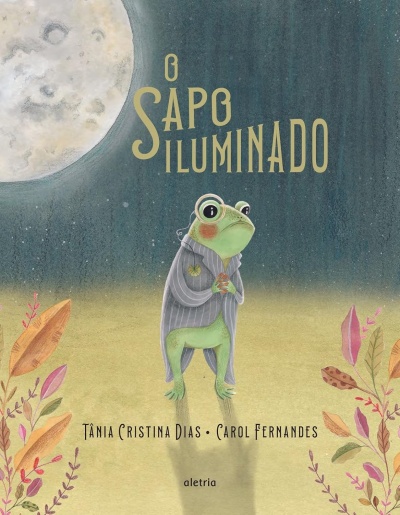 Capa de livro com ilustração de um sapo vestido de casaco sob a lua, com texto O SAPO ILUMINADO e nomes de autores