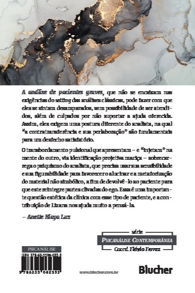 Capa de livro branco com texto em português sobre psicanálise, em cima de superfície marmoreada cinza, preto e dourado