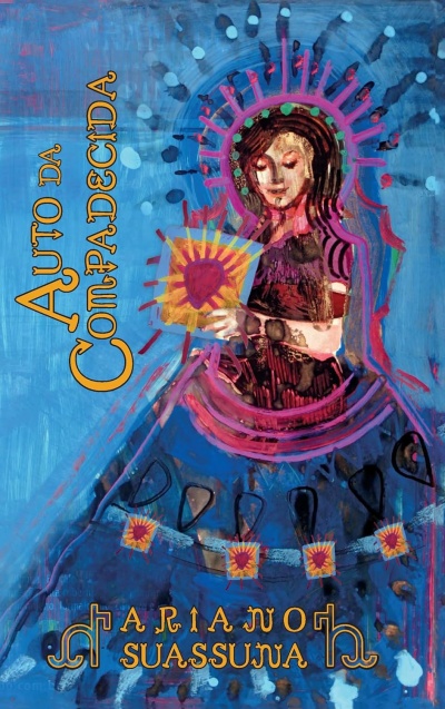 Capa de livro azul com ilustração colorida e texto AUTO DA COMPADECIDA e ARIANO SUASSUNA