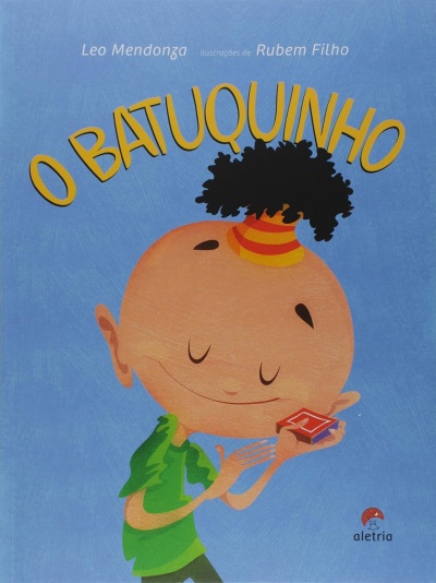 Capa do livro infantil O BATUQUINHO com ilustração de criança feliz e texto em amarelo sobre fundo azul.
