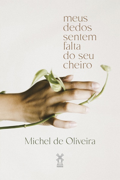Mão humana segurando caule verde com folhas e texto em português.