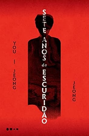 Capa de livro vermelha com silhueta negra e texto vertical branco
