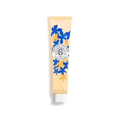 Tubo de creme de mãos com padrão floral azul e amarelo