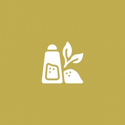 Ícone branco de saleiro e sal com folhas em fundo laranja pálido