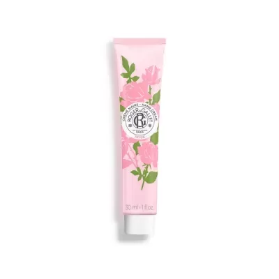 Tubo rosa de creme com estampado de rosas e texto ROGER & GALLET PARIS