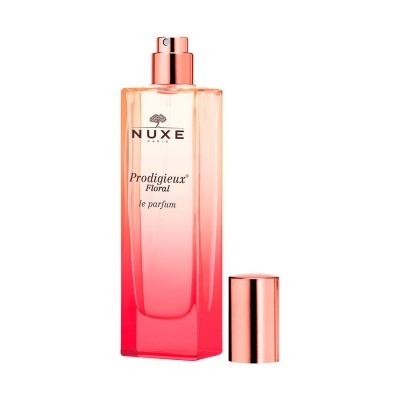 Frasco de perfume NUXE Prodigieux Floral em vidro gradiente rosa com tampa metálica ao lado