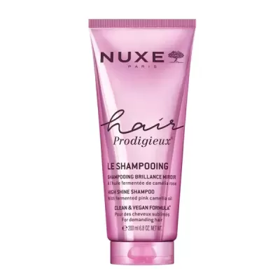 Champô NUXE Hair Prodigieux em tubo rosa com texto preto e branco