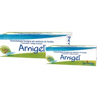Embalagem e tubo de creme Arnigel branco com verde e azul, texto Arnigel e Boiron visível.