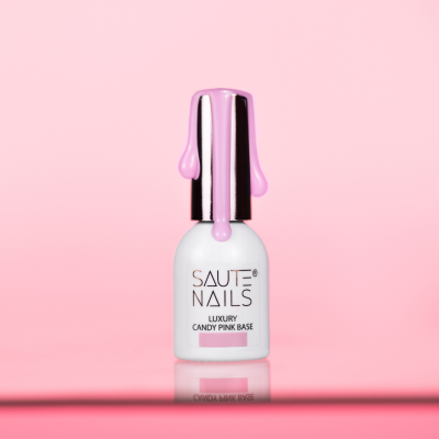 Frasco branco de verniz de unhas SAUTE NAILS com tampa preta e verniz rosa a escorrer