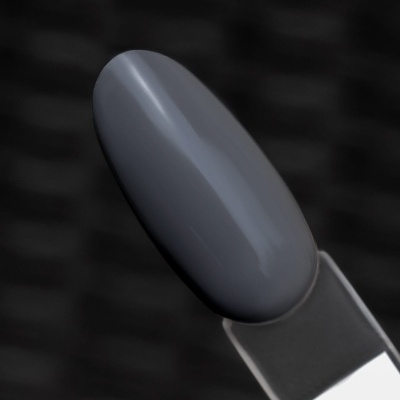 Amostra de verniz ou esmalte cinzento sobre suporte plástico.