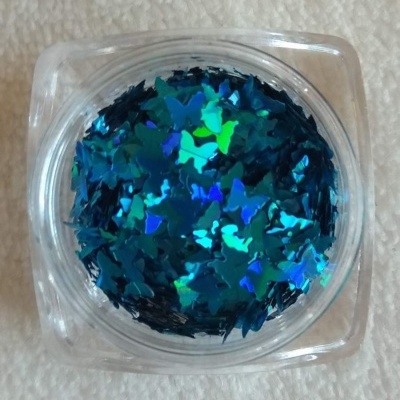 Frasco com estrelas holográficas azuis e verdes