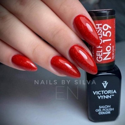 Unhas vermelhas brilhantes com verniz gel e frasco de verniz gel preto e vermelho