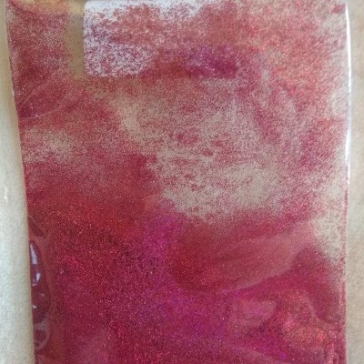 Pacote plástico com glitter rosa e vermelho brilhante