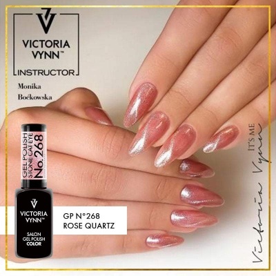 Unhas compridas pintadas com verniz rosa brilhante, garrafinha de verniz gel preto
