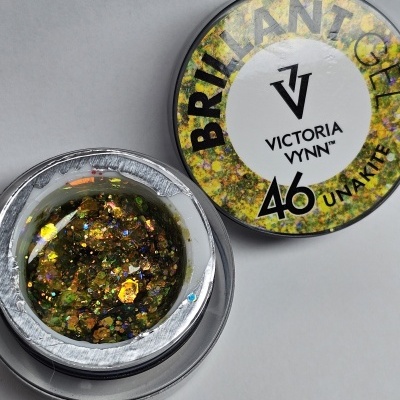 Gel para unhas com glitter dourado e verde em embalagem redonda preta com tampa branca.