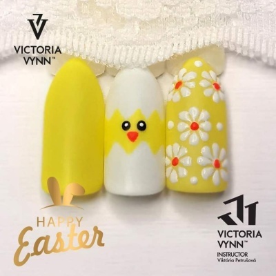 Unhas postiças amarelas e brancas decoradas com pintinho e flores para Páscoa