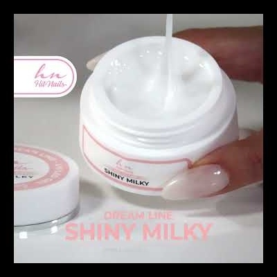 Creme branco em frasco branco e rosa para unhas com rótulo 'bn UV Nails SHINY MILKY'