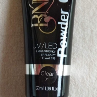 Frasco preto de gel para unhas RND Powder Gel 30ml com texto branco.