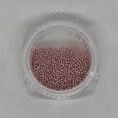 Pote transparente com pequenas bolinhas rosas