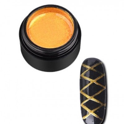 Frasco preto com produto dourado e unha artificial preta com padrão dourado