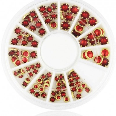 Roda plástica com pedras vermelhas e aros dourados