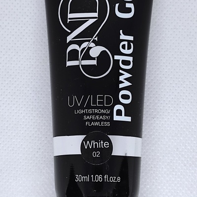 Tubo preto de gel em pé com texto branco e tampa preta em fundo branco