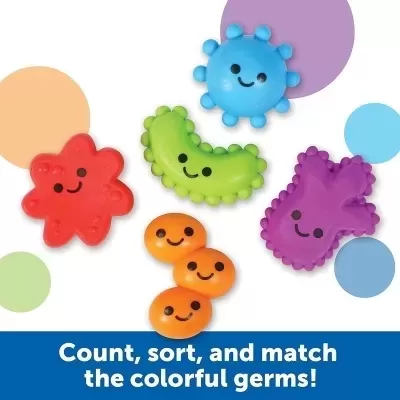 Brinquedos coloridos em forma de germes com carinhas sorridentes sobre fundo branco com círculos coloridos