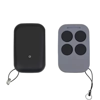 Dois comandos remotos em preto e cinza com botões redondos pretos.