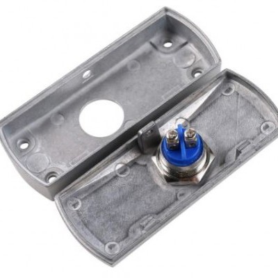 Caixa metálica cinzenta com botão azul e duas partes desmontadas