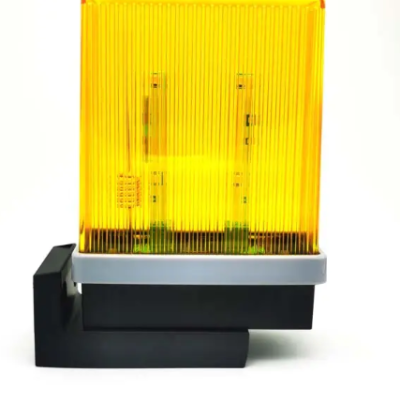 Luminária amarela translúcida com base preta em forma de L