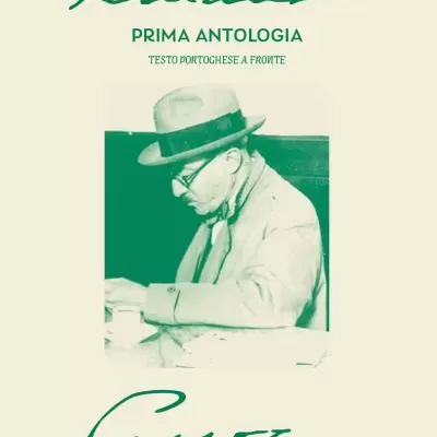 Book cover with green photo of man in hat and glasses and green text on cream background