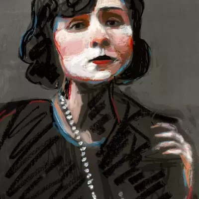 Artistic portrait of a woman with black hair and beaded necklace on gray background