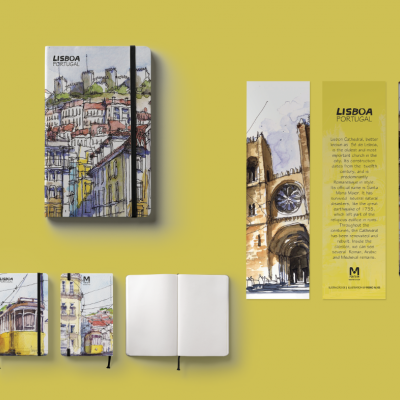 Conjunto de cadernos, marcador de livros, separador sobre Lisboa e lápis com ilustrações coloridas, fundo amarelo.