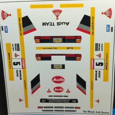 Folha de autocolantes para modelo Hot Wheels Audi Quattro com várias marcas e números.