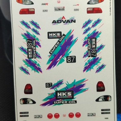 Folha de autocolantes para modelo Hot Wheels Honda EJ1 com várias marcas e desenhos coloridos.