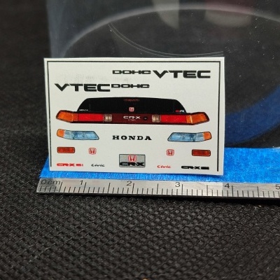 Decalques para modelo de automóvel Honda VTEC com vários textos e símbolos em fundo branco
